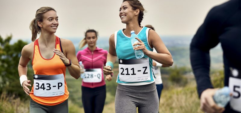 young-happy-athletic-women-running-a-marathon-in-nature-.jpg